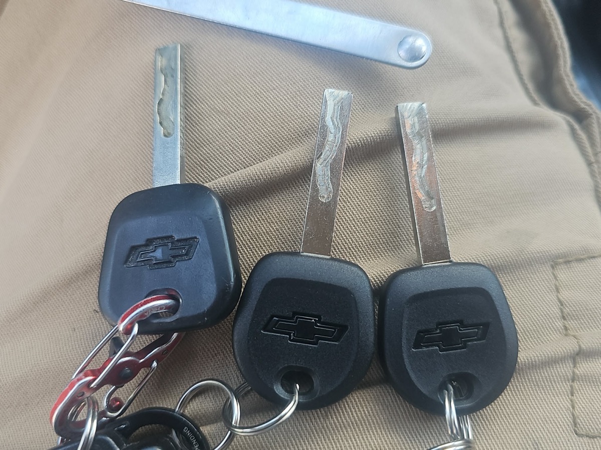Three keys have been cut for a Chevy vehicle