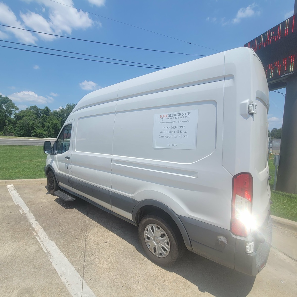 Keymergency Locksmith mobile service van parked on a job